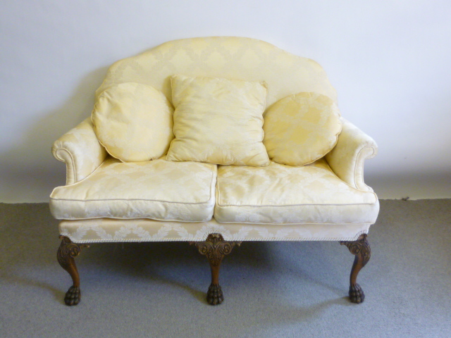 Appraisal: A MAHOGANY FRAMED TWO SEATER SOFA th century upholstered in