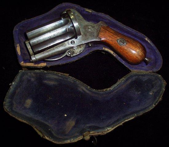 Appraisal: A pepper pot six chamber rim fire revolver with plain