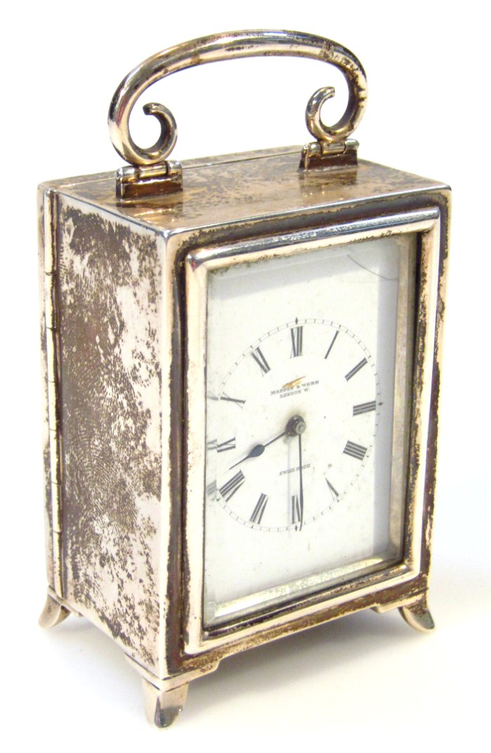 Appraisal: A late Victorian silver travelling clock the white dial with