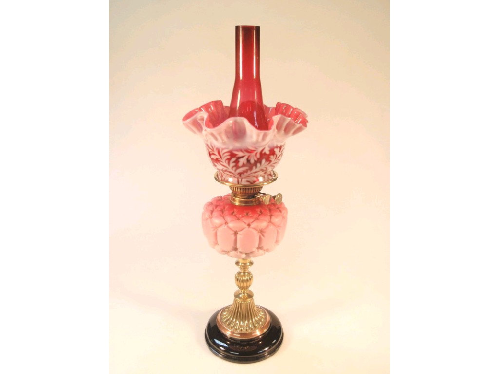 Appraisal: A thC oil lamp the Stourbridge pink satin quilted glass