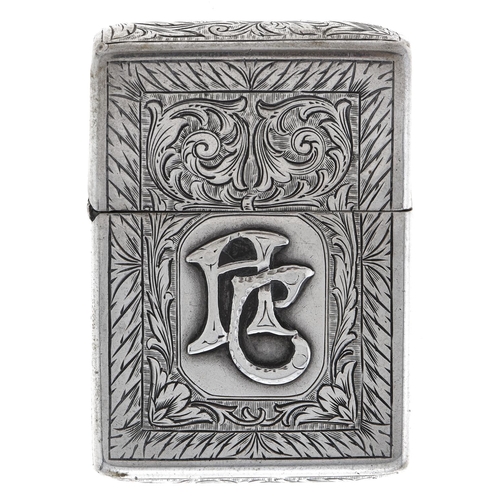 Appraisal: A Continental silver petrol lighter c foliate engraved and applied