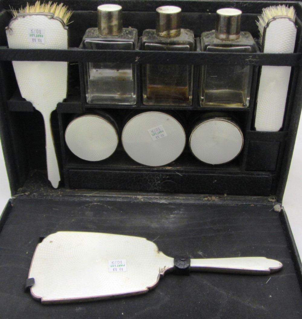 Appraisal: A ladies silver mounted toilet set comprising a hand mirror