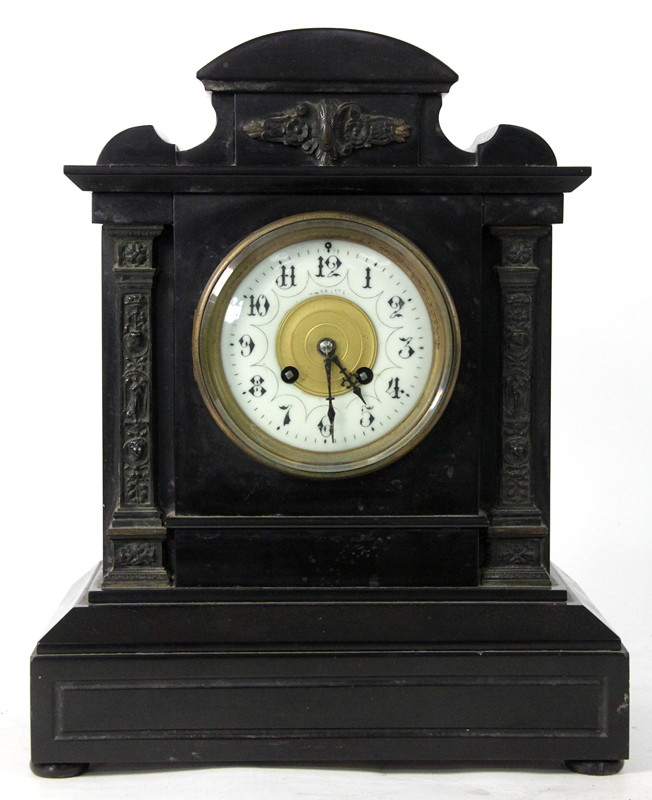 Appraisal: A Victorian black mantel clock with applied decoration fitted an