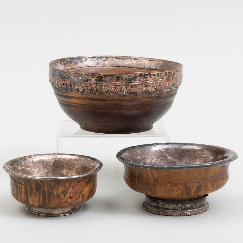 Appraisal: Three Metal-Mounted Turned Wood Bowls One engraved with 'M' The