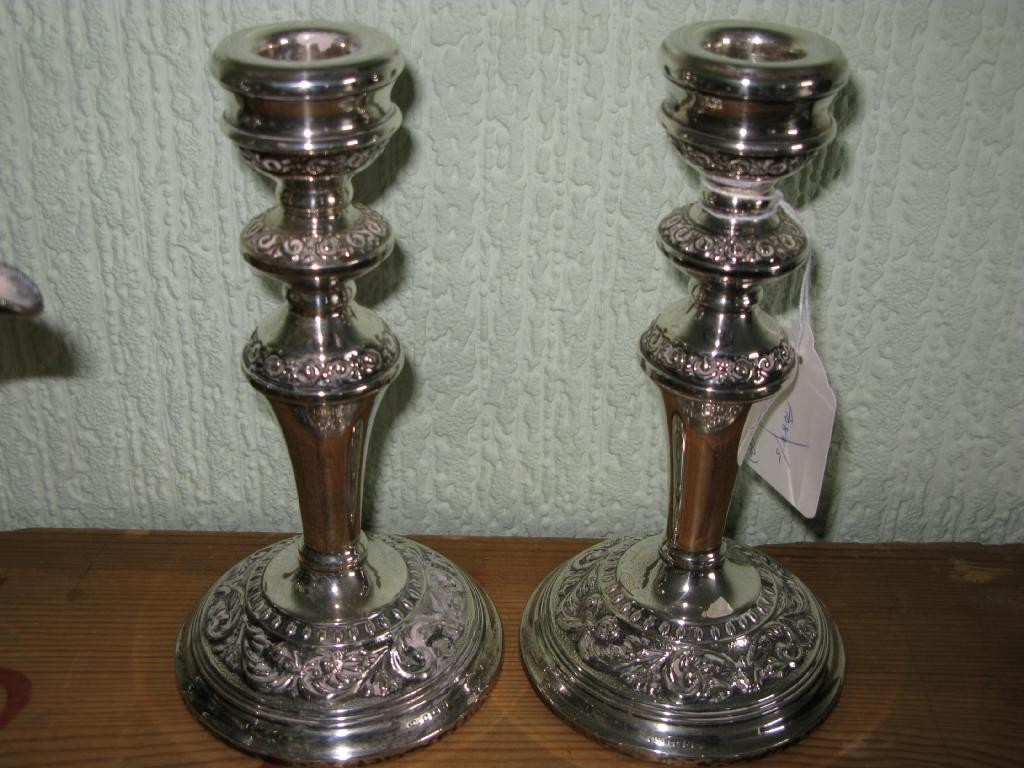 Appraisal: A pair of silver candlesticks knopped form on loaded bases