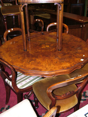 Appraisal: A walnut pedestal table th century the shaped top with