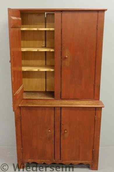 Appraisal: Step-back cupboard c with red paint decoration and scalloped shelved