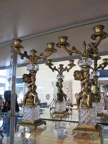 Appraisal: PAIR OF ITALIAN GILT METAL CHERUB ADORNED CANDELABRA