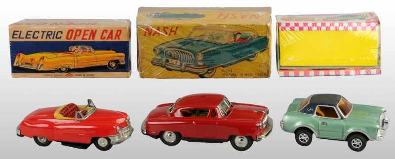 Appraisal: Lot of Tin Litho Automobile Toys Description Japanese Working Includes