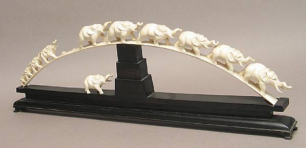 Appraisal: An ivory elephant bridge Featuring a line of eleven elephants