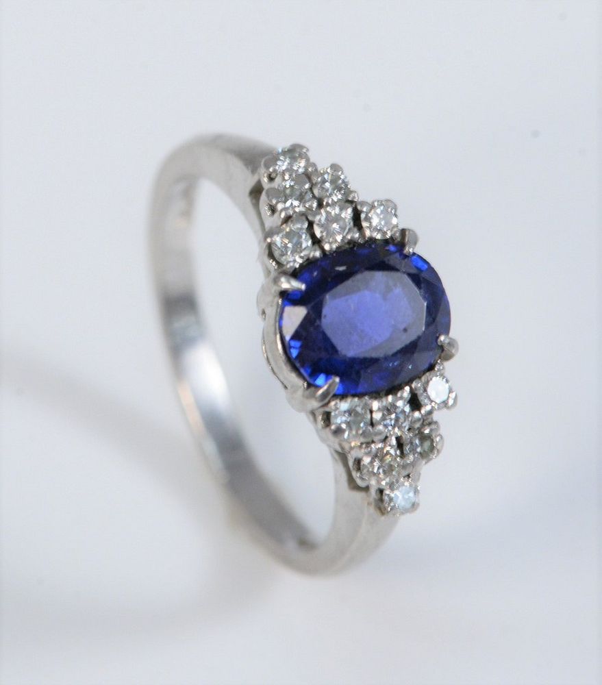 Appraisal: Platinum Ring set with center oval blue stone flanked by