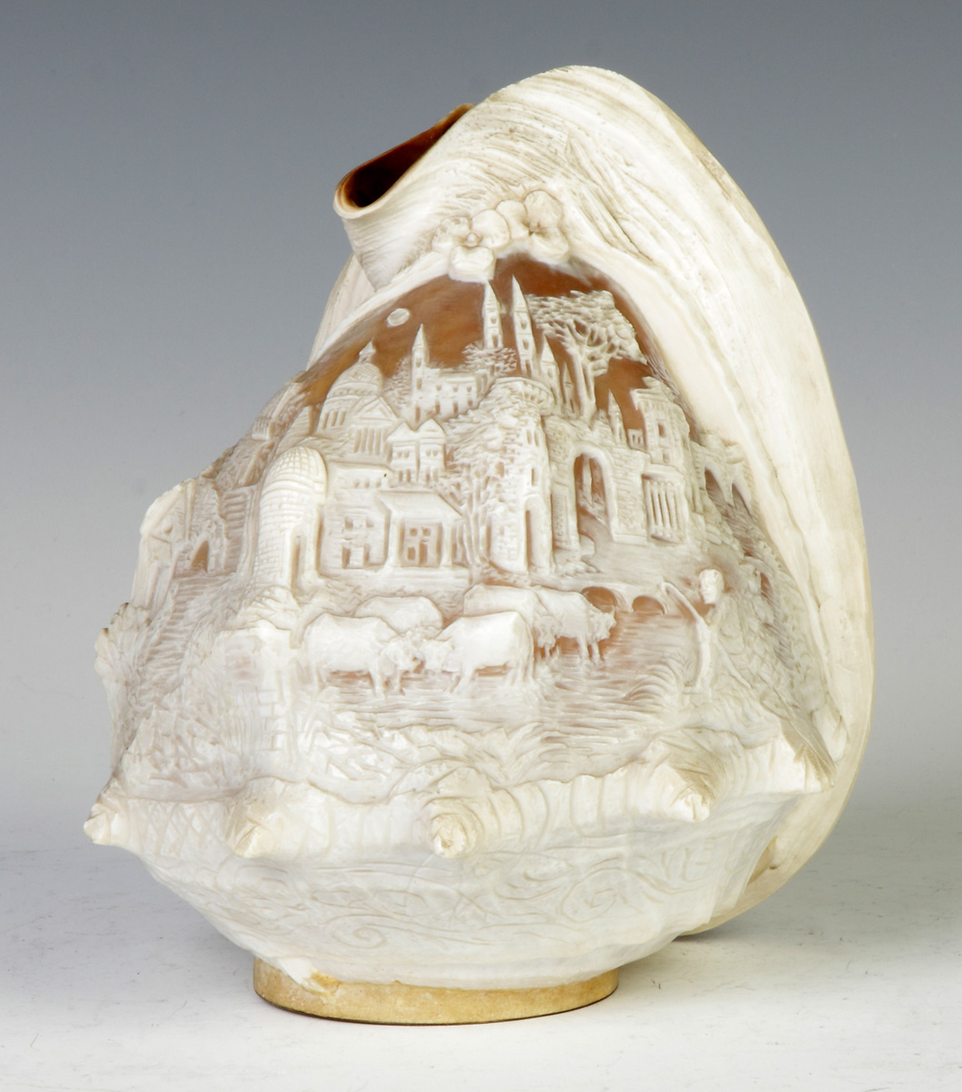 Appraisal: Carved Shell Lamp Shade th cent Castle scene