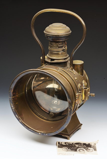 Appraisal: A LARGE AMERICAN EARLY CAR HEADLAMP THE POLKEY the oil