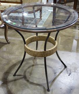 Appraisal: McGuire style occasional table having a circular plate glass top