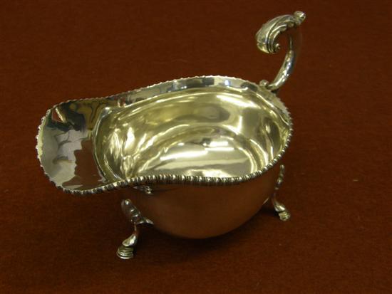 Appraisal: George V silver sauce boat with gadrooned rim scroll handle