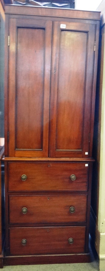 Appraisal: A made-up th century tall narrow cupboard on chest the