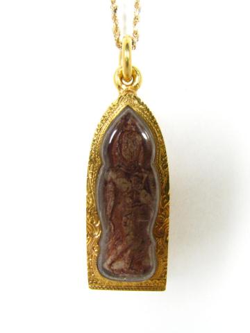 Appraisal: K Yellow Gold Carved Figural Pendant Under Glass The pendant