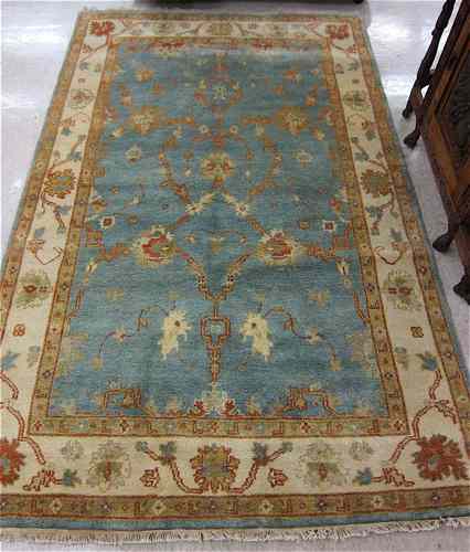 Appraisal: HAND KNOTTED ORIENTAL AREA RUG Indo-Persian having a light blue