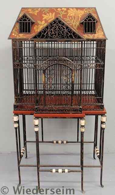 Appraisal: Fine large standing wrought iron birdcage th c with decorated