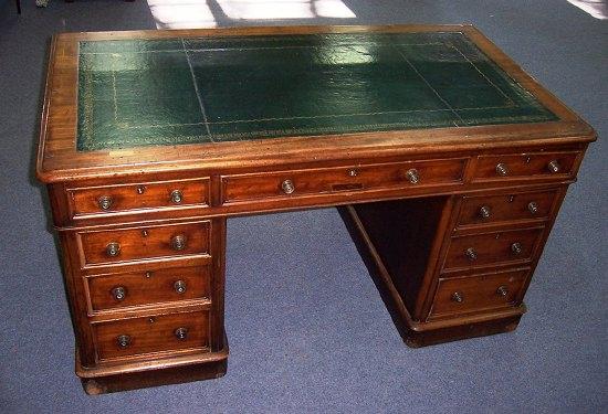 Appraisal: A Victorian pedestal desk the top with inset leather writing