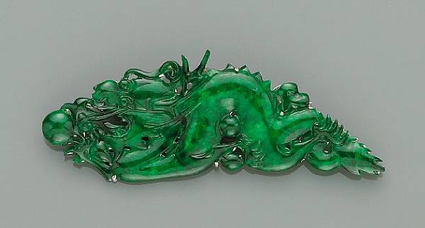 Appraisal: A good green jade pendant Thinly sectioned carved in openwork