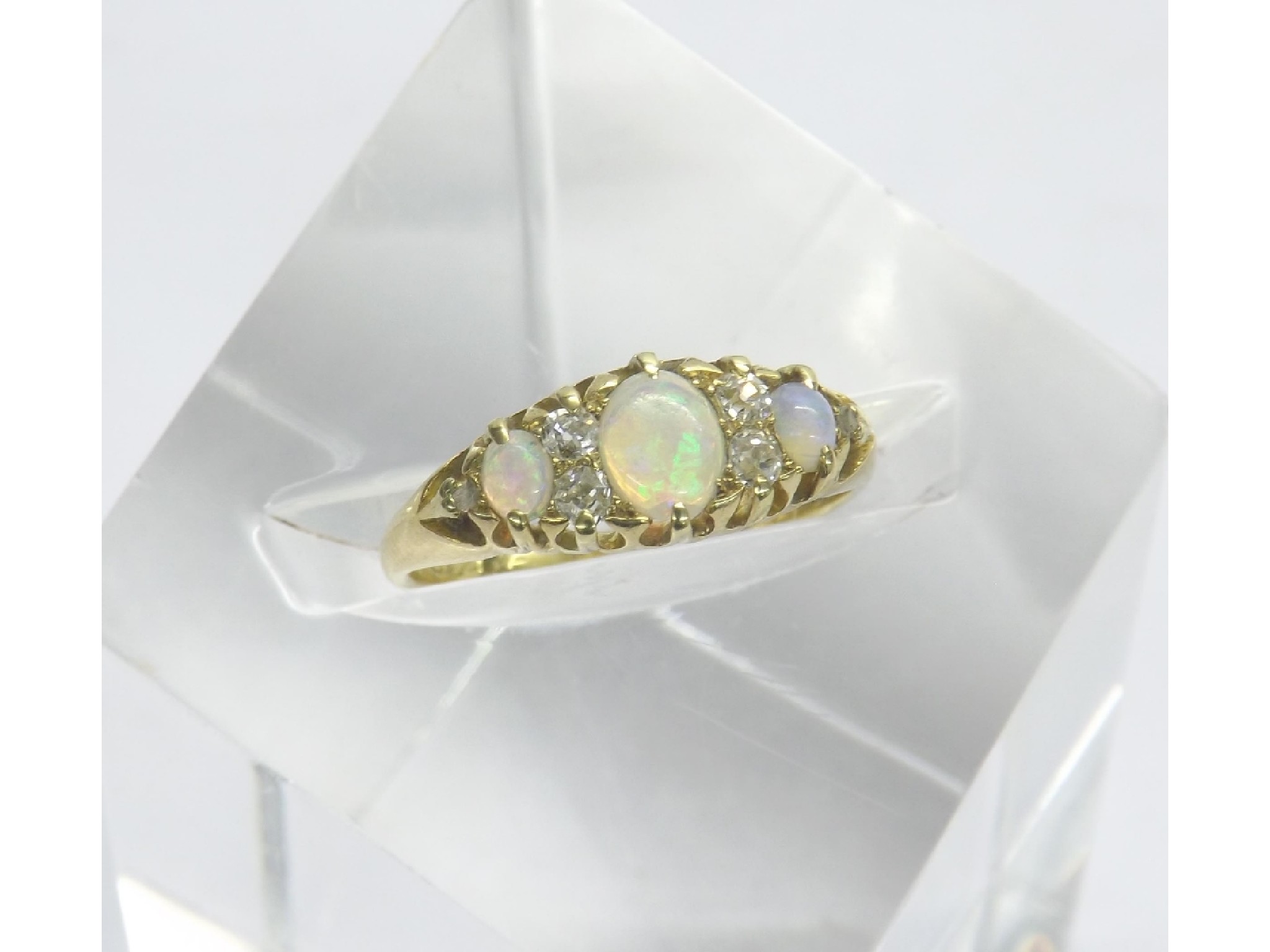 Appraisal: Attractive period ct opal and diamond claw set ring with