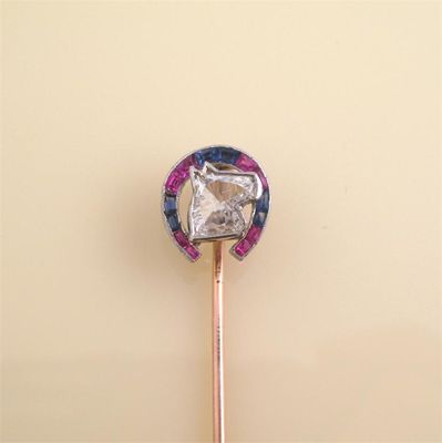 Appraisal: La Cloche A carved diamond stick pin The diamond horse