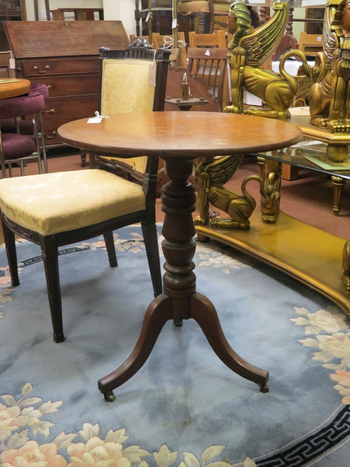 Appraisal: A Victorian oak tripod table circular top on turned stem