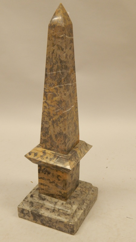 Appraisal: A modern variegated marble obelisk with a stepped base cm