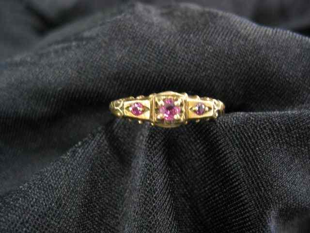 Appraisal: Ruby Ring trio of pinkish red gems inantique k yellow