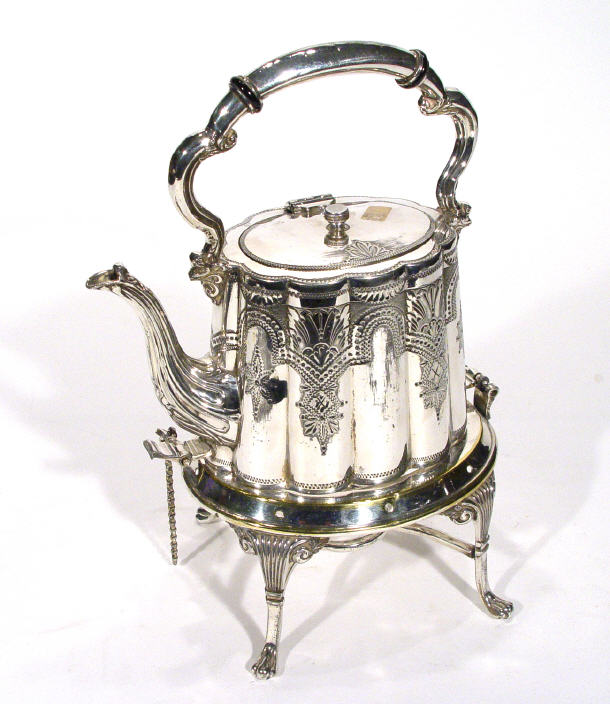 Appraisal: Victorian fluted silver plated teapot on hinged stand with claw