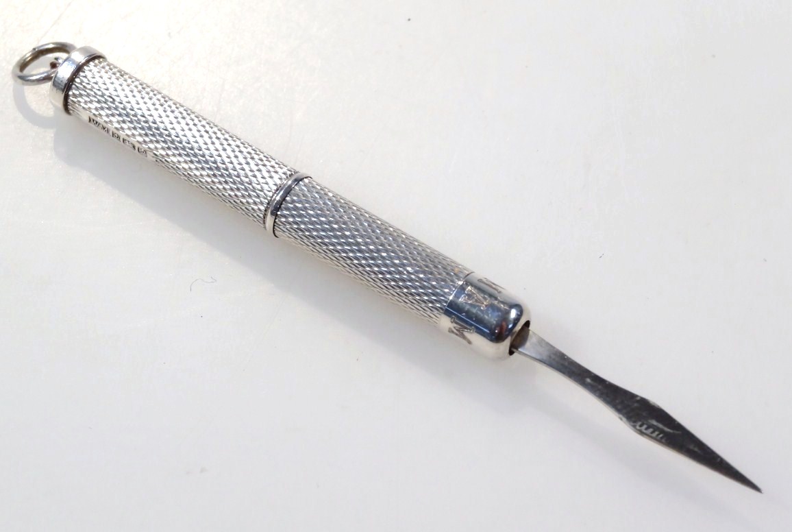 Appraisal: An Elizabeth II silver propelling toothpick with articulated cylindrical part