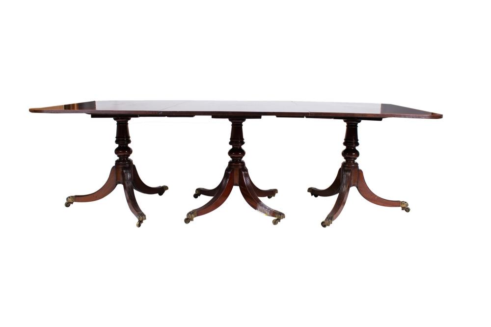 Appraisal: MAHOGANY TRIPLE PEDESTAL DINING TABLEin the Regency style set atop