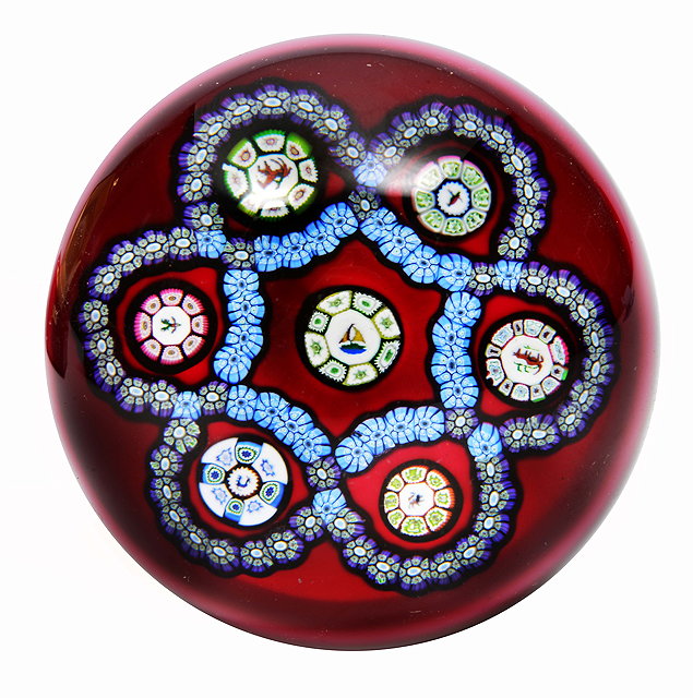 Appraisal: A PERTHSHIRE PAPERWEIGHT with seven canes each with different decoration