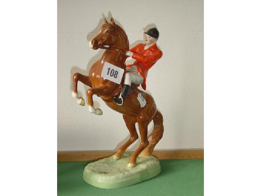 Appraisal: A Beswick model of a red jacketed rider on a