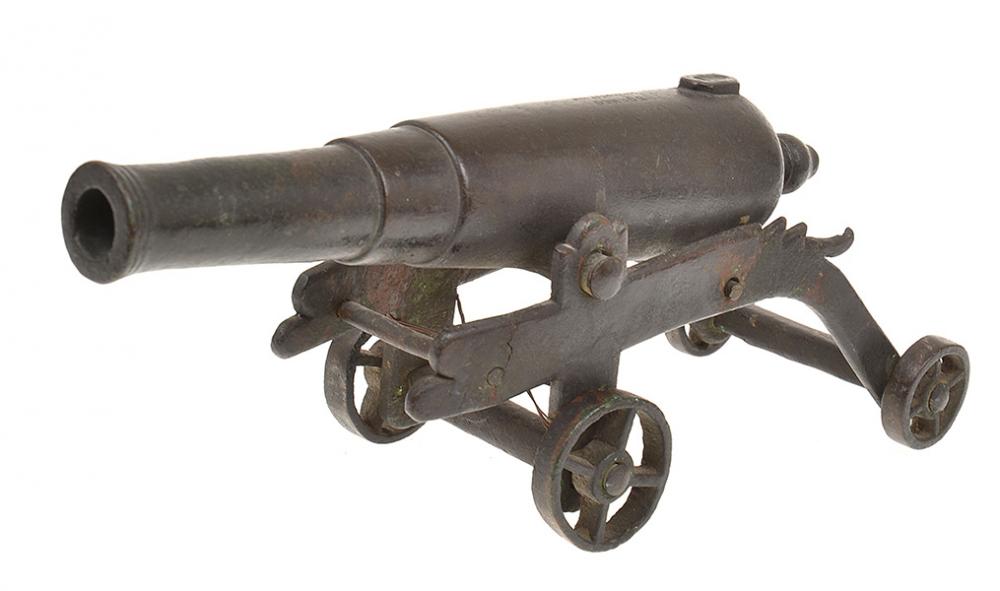 Appraisal: A PRESENTATION IRON MODEL CANON WITH STEPPED BARREL INSCRIBED 'BORNEO