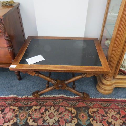 Appraisal: Black Marble Top Coffee Table with intaglio carved sailboat design