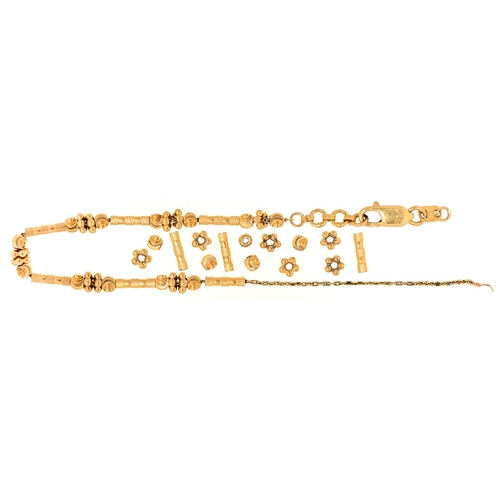 Appraisal: A Malaysian gold bracelet of threaded links over fine chain