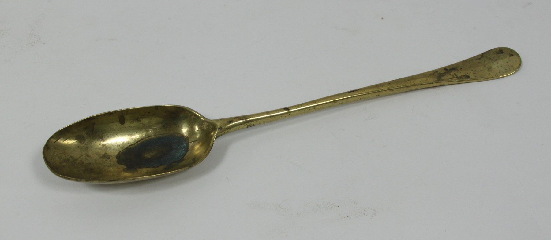 Appraisal: An th Century brass basting spoon cm long