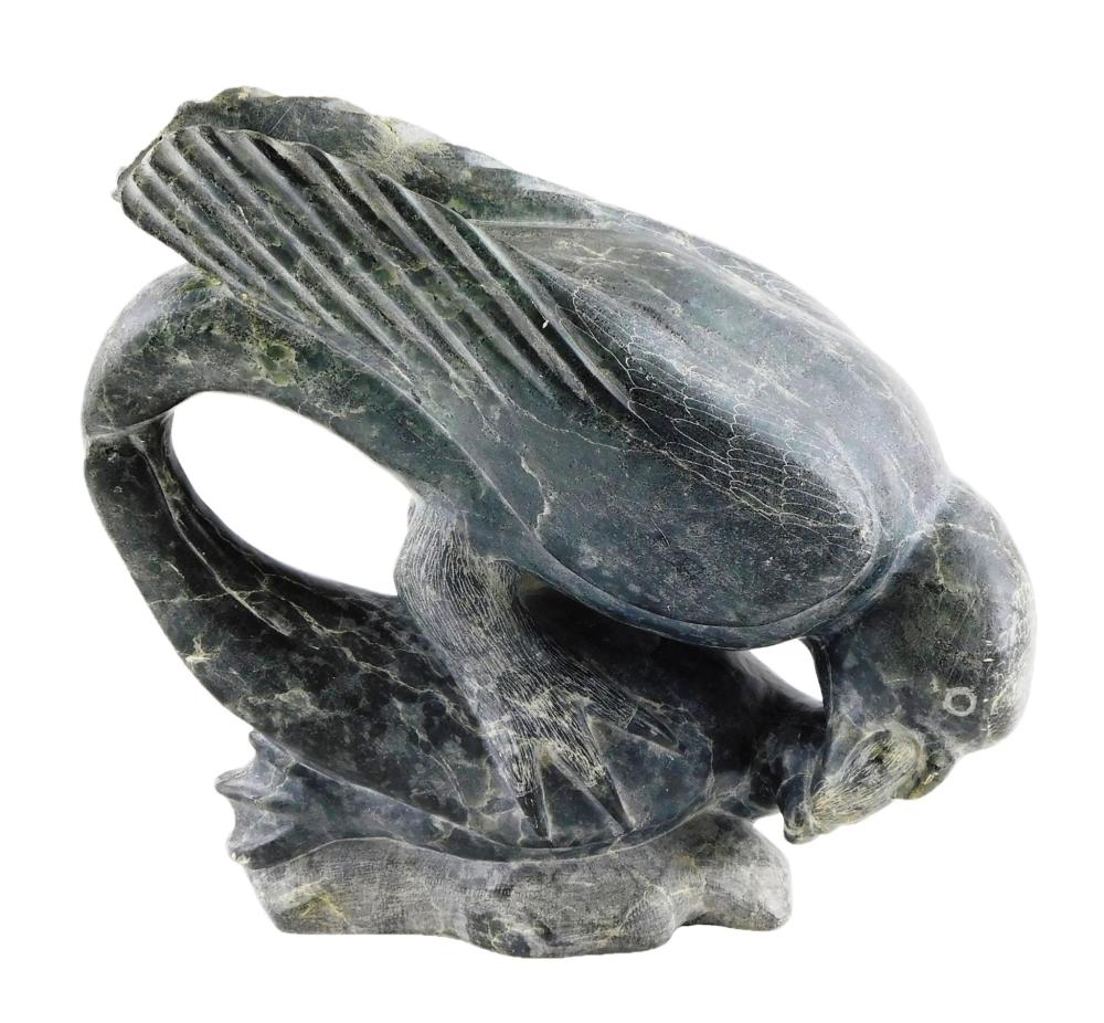 Appraisal: TRIBAL Inuit carved stone sculpture of seal pinned down by