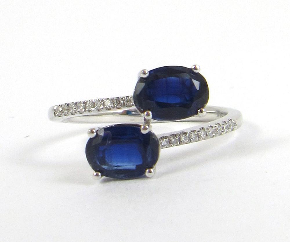 Appraisal: SAPPHIRE DIAMOND AND FOURTEEN KARAT WHITE GOLD RING with a