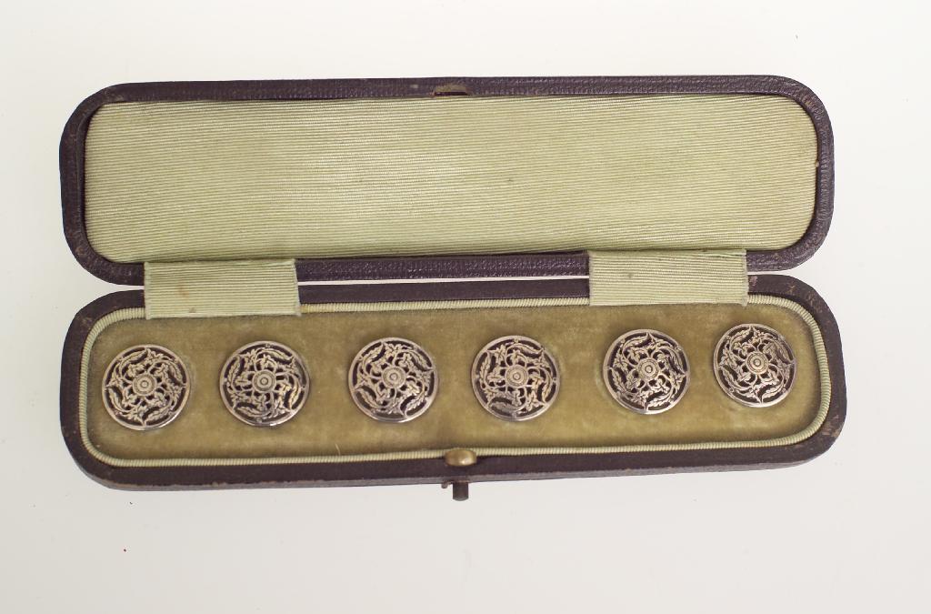 Appraisal: SET OF SIX EDWARDIAN SILVER BUTTONS cased each pierced with