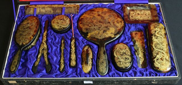 Appraisal: A cased Edwardian twelve-piece tortoiseshell vanity set