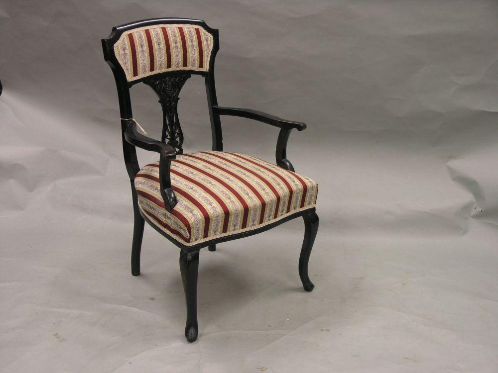 Appraisal: A Victorian ebonised elbow chair with upholstered seat and back