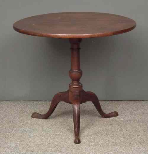 Appraisal: A George III mahogany circular tripod table with solid one