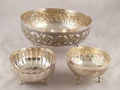 Appraisal: A white metal bowl on three feet together with two