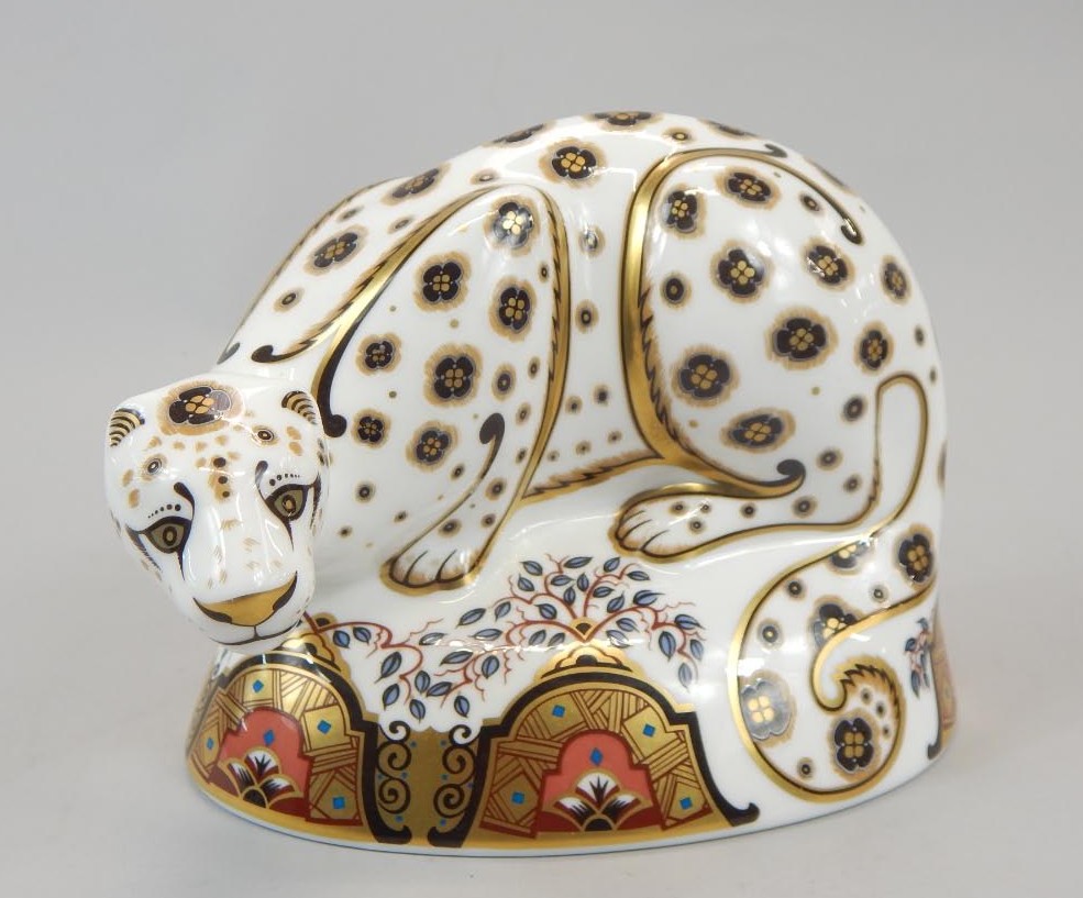 Appraisal: A Royal Crown Derby porcelain snow leopard paperweight gold button