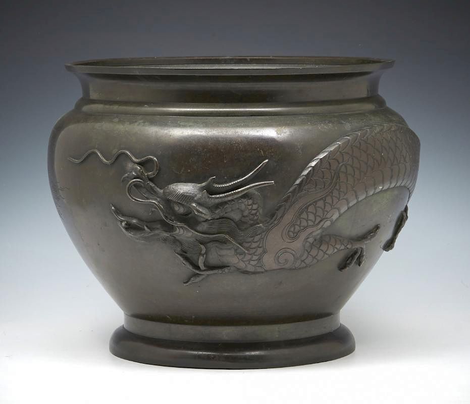 Appraisal: Large bronze bowl encircled by a dragon h Large bronze