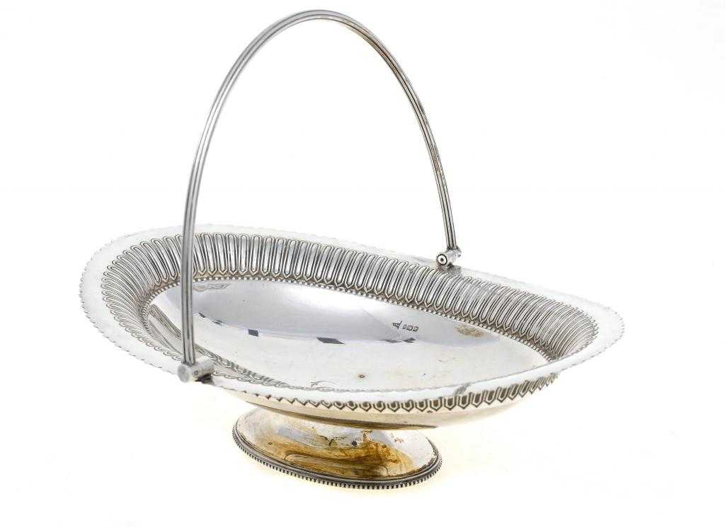 Appraisal: A VICTORIAN CAKE BASKET the scalloped oval bowl with reeded