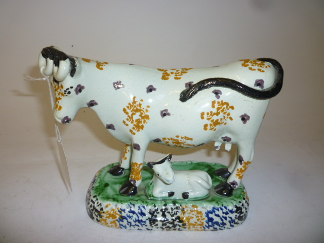 Appraisal: A PRATTWARE MODEL OF A COW early th century with